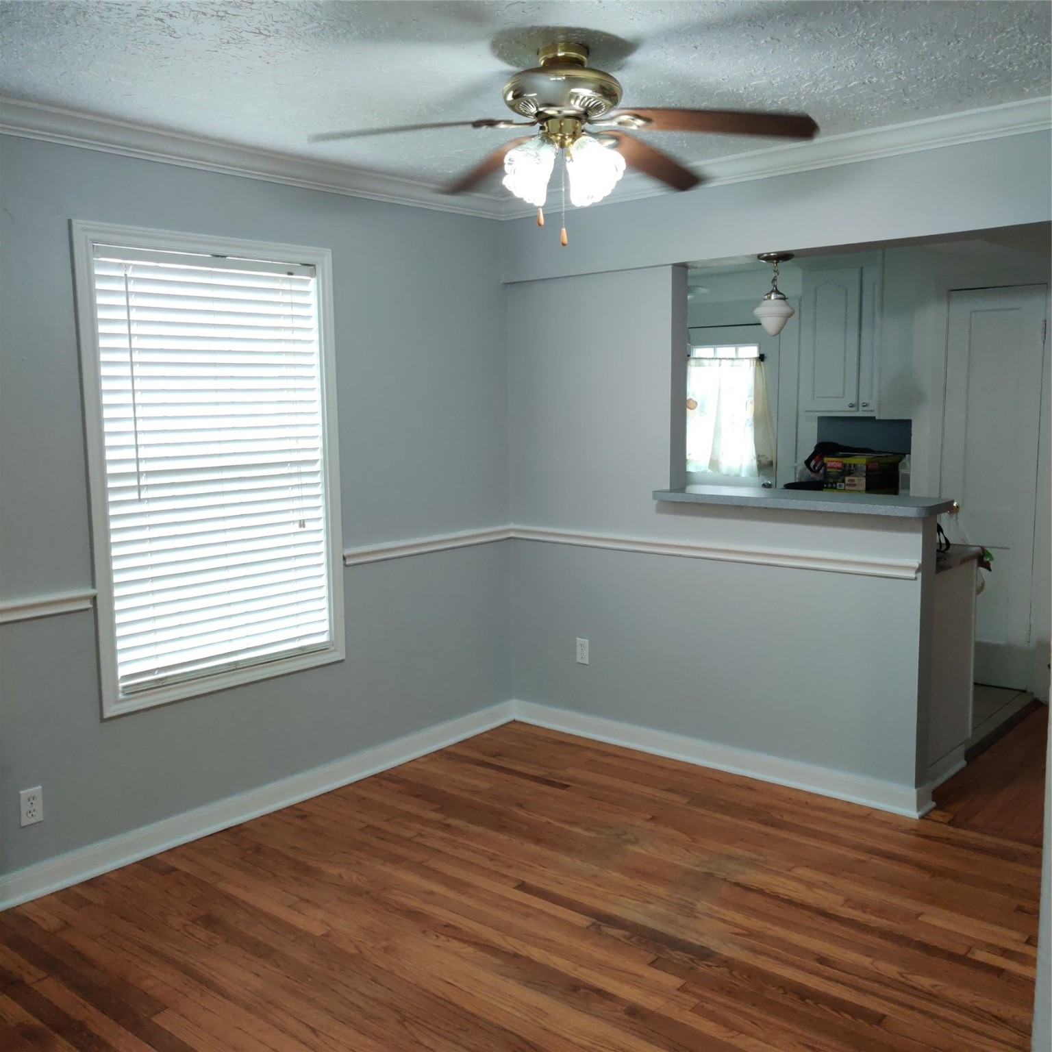 919 Oak Meadows Street Houston, TX 77017 - Photo 7 of 12 a view of a kitchen with a dishwasher cabinets and a wooden floor