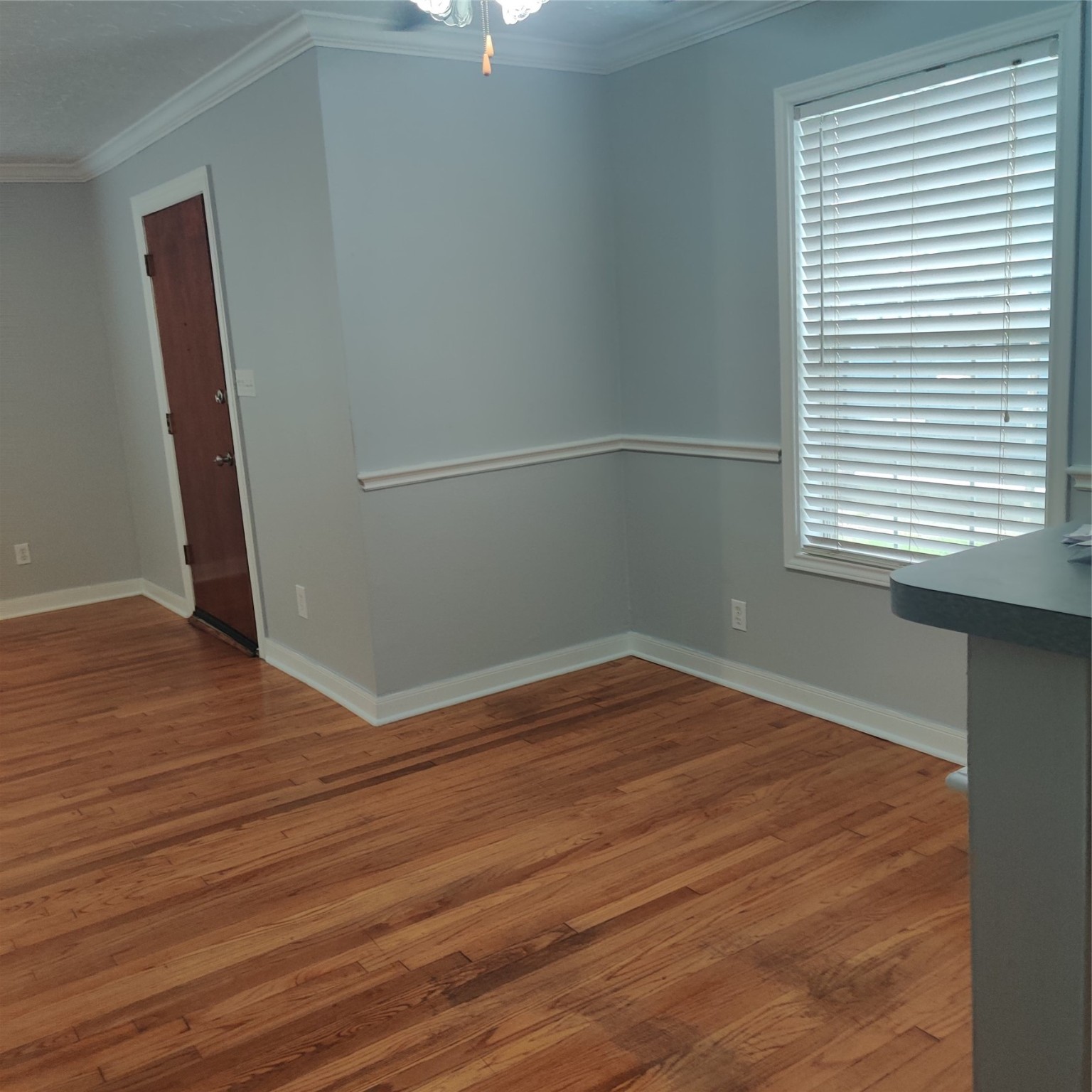 919 Oak Meadows Street Houston, TX 77017 - Photo 9 of 12 an empty room with wooden floor and windows