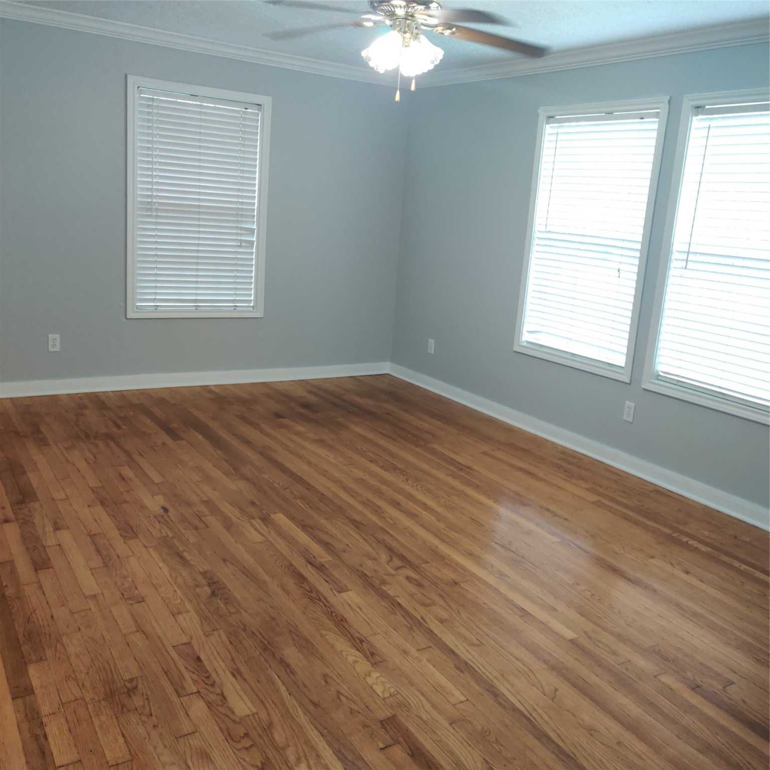 919 Oak Meadows Street Houston, TX 77017 - Photo 10 of 12 a view of an empty room with wooden floor and a window