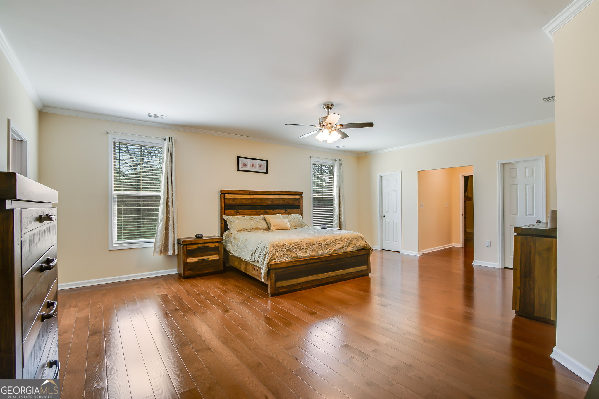 733 Cherry Road Franklin, GA 30217 - Photo 11 of 22 a bedroom with a bed and a chandelier