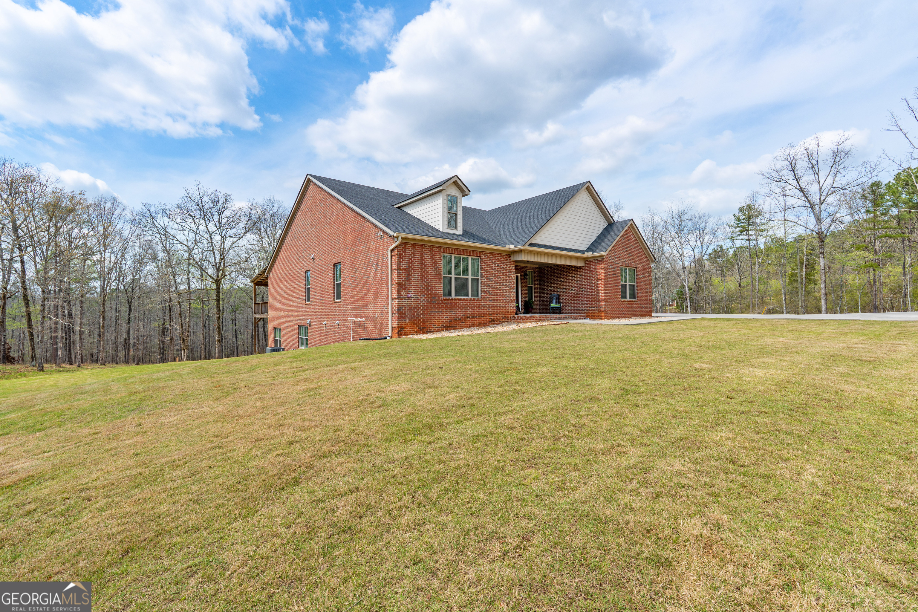 733 Cherry Road Franklin, GA 30217 - Photo 12 of 88 a view of a house with a yard and garage