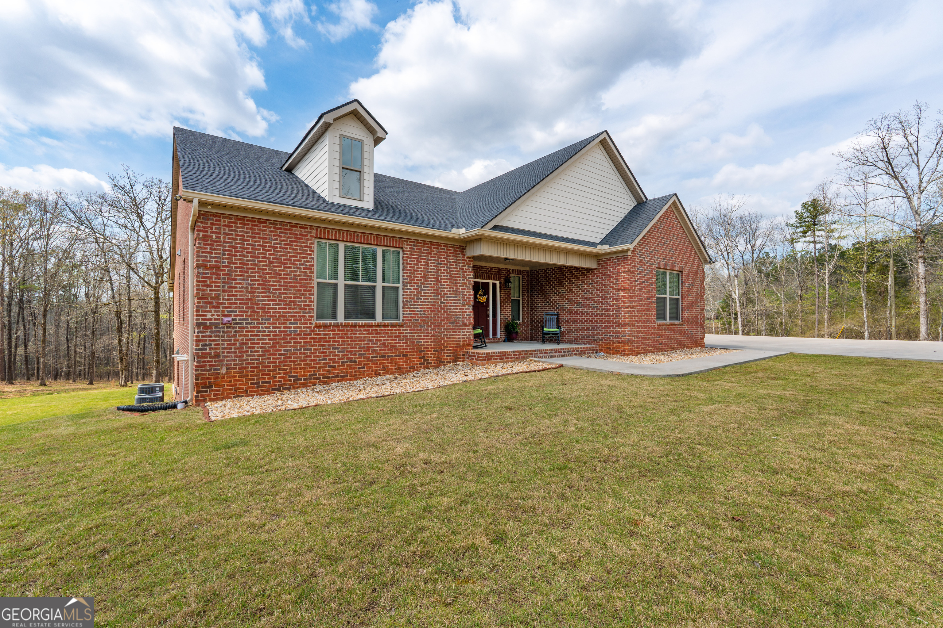 733 Cherry Road Franklin, GA 30217 - Photo 14 of 88 a front view of a house with garden