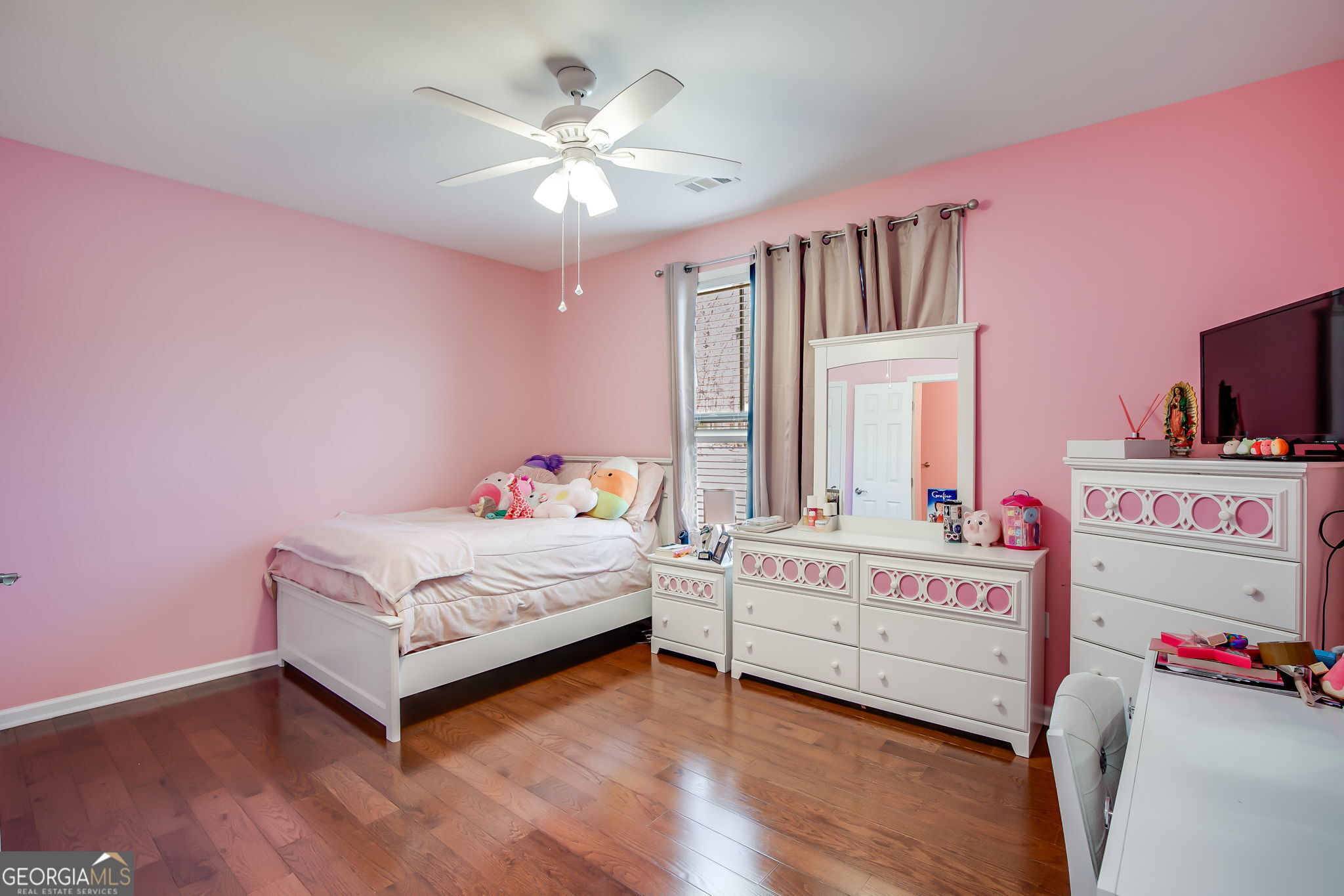 733 Cherry Road Franklin, GA 30217 - Photo 15 of 22 a bedroom with a bed and a chandelier
