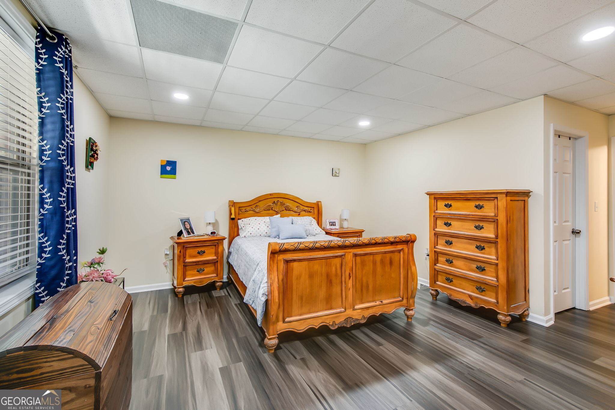 733 Cherry Road Franklin, GA 30217 - Photo 19 of 22 a bedroom with a bed and wooden floor