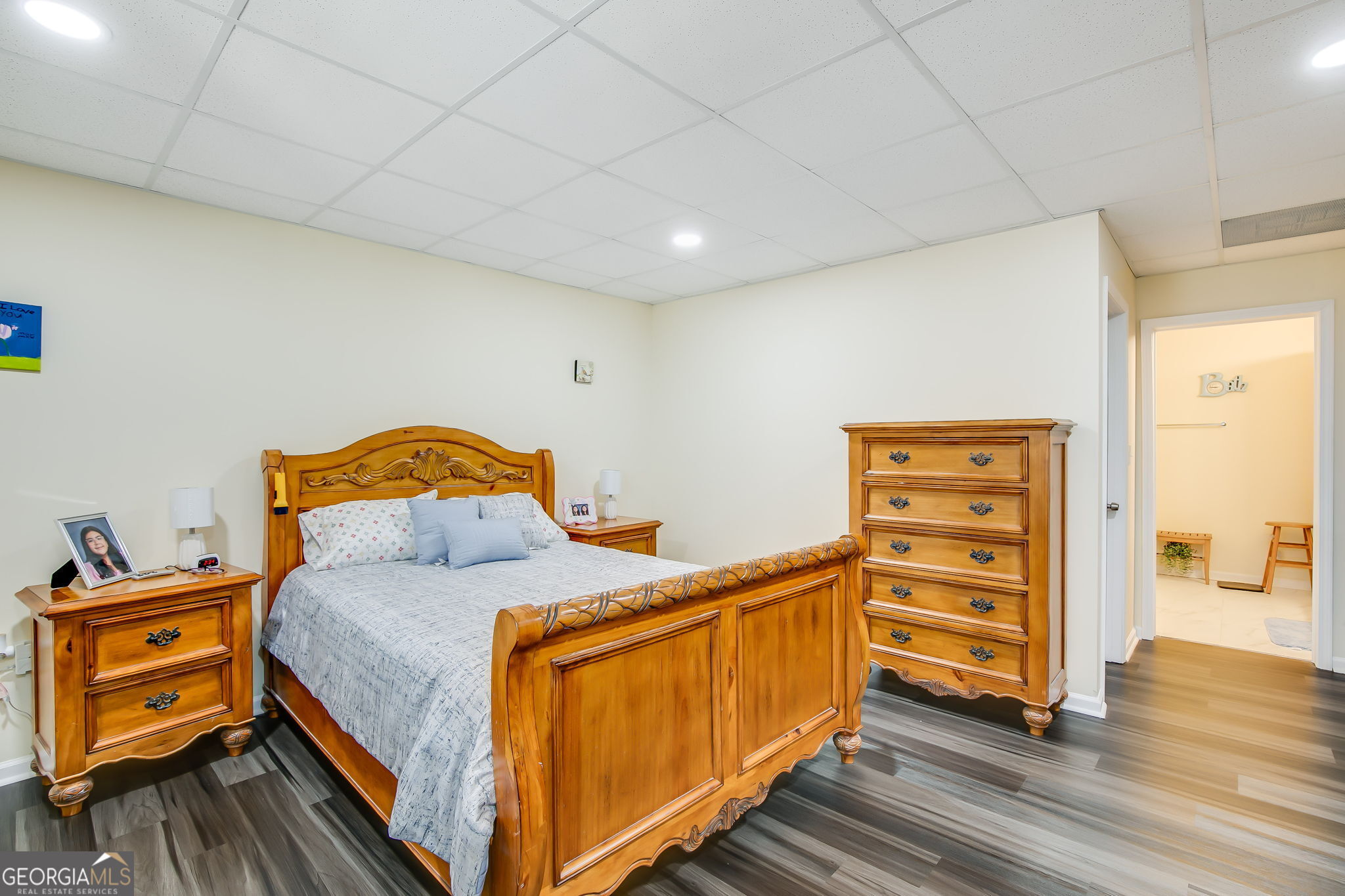 733 Cherry Road Franklin, GA 30217 - Photo 20 of 22 a bedroom with a bed and wooden floor