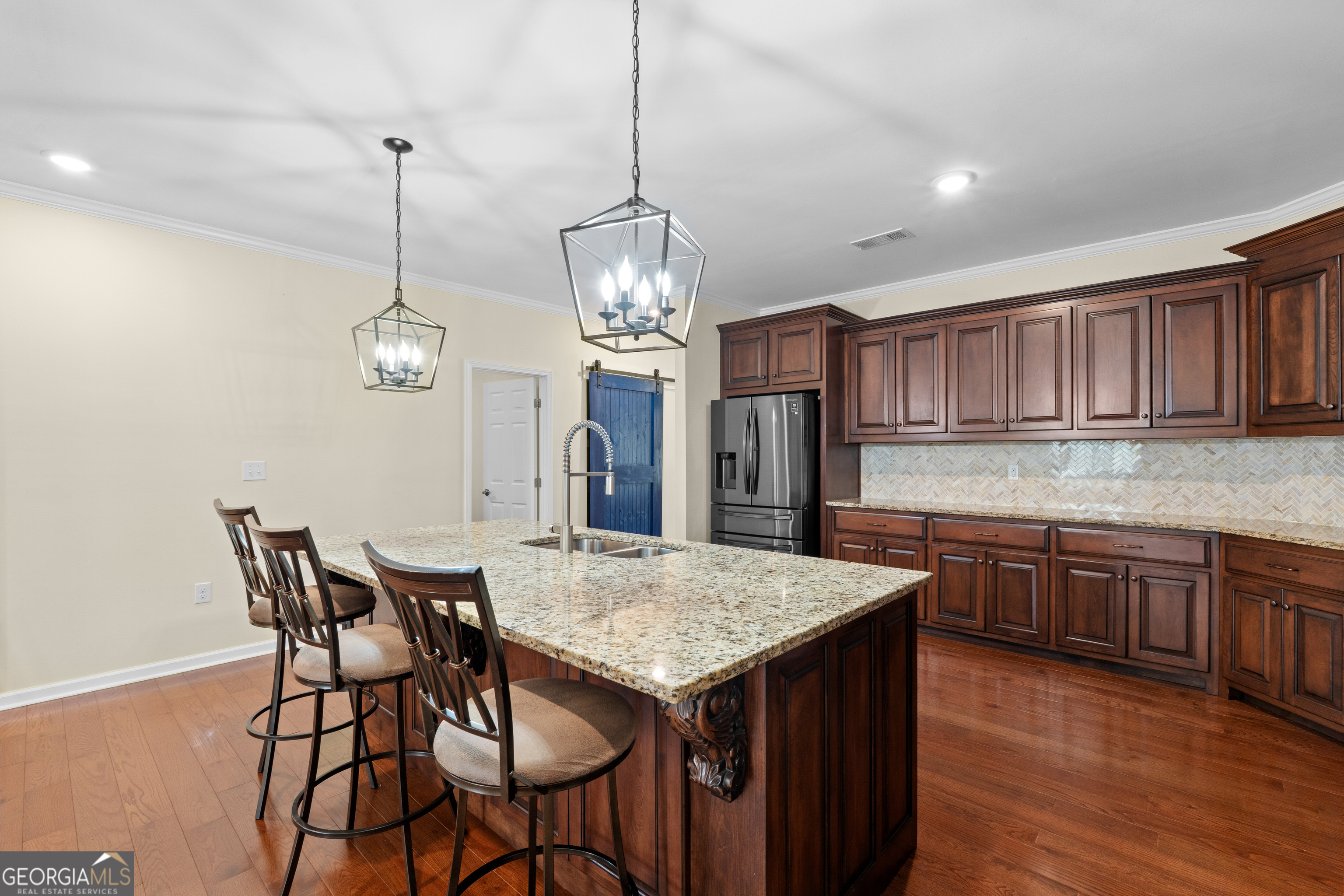 733 Cherry Road Franklin, GA 30217 - Photo 25 of 88 a open kitchen with a dining table and wooden floor