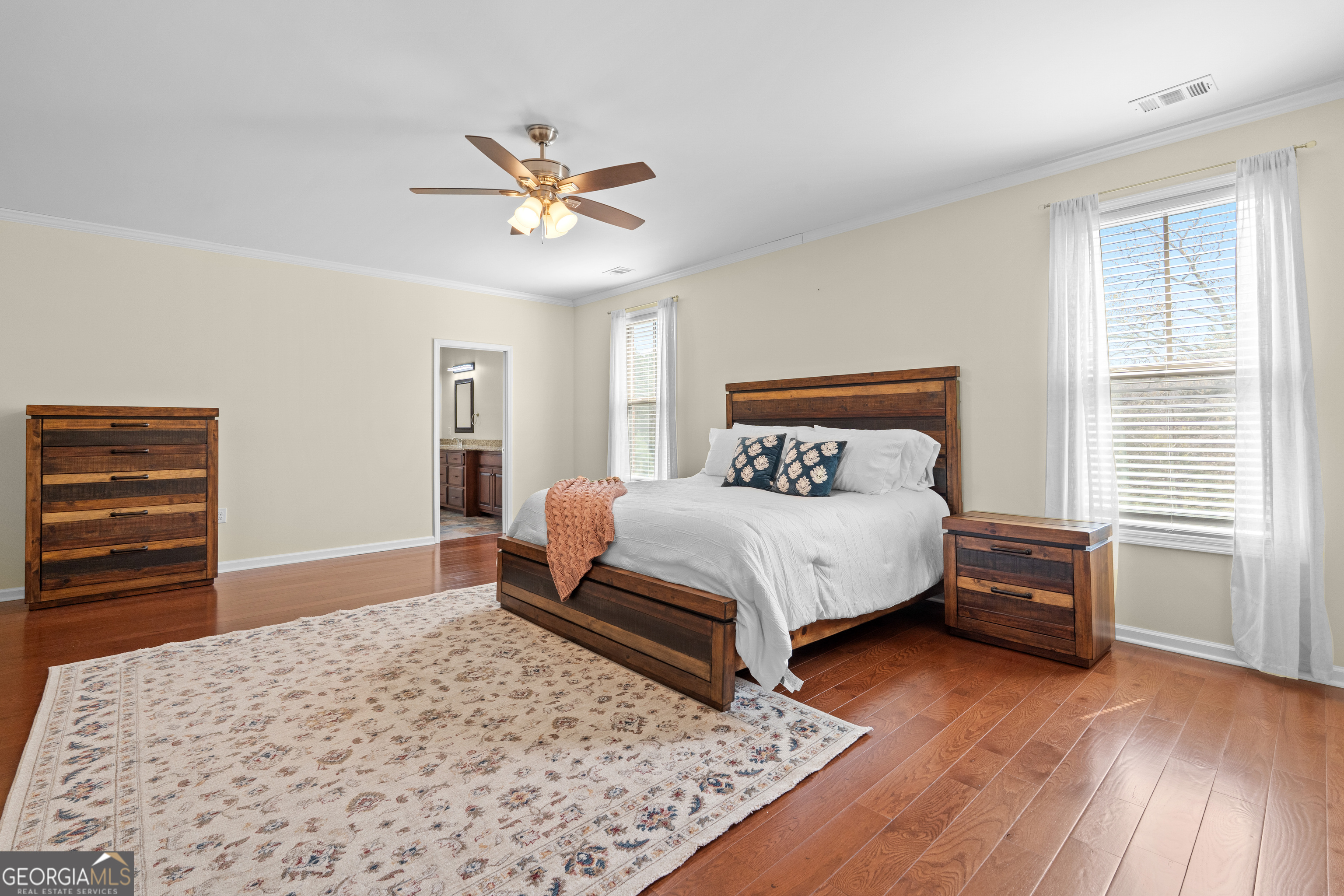 733 Cherry Road Franklin, GA 30217 - Photo 35 of 88 a bedroom with a bed and wooden floor