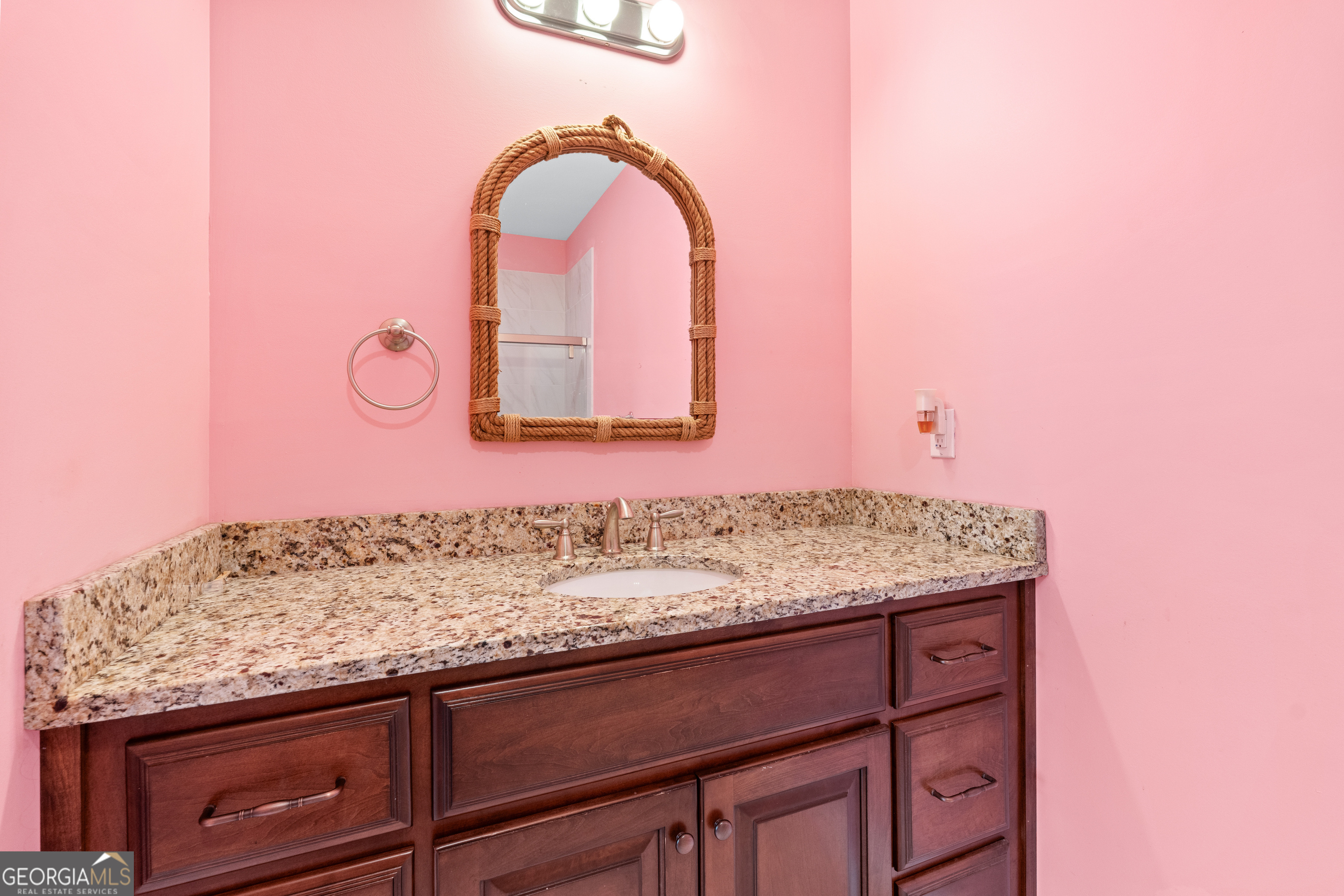 733 Cherry Road Franklin, GA 30217 - Photo 47 of 88 a bathroom with a granite countertop sink and a mirror