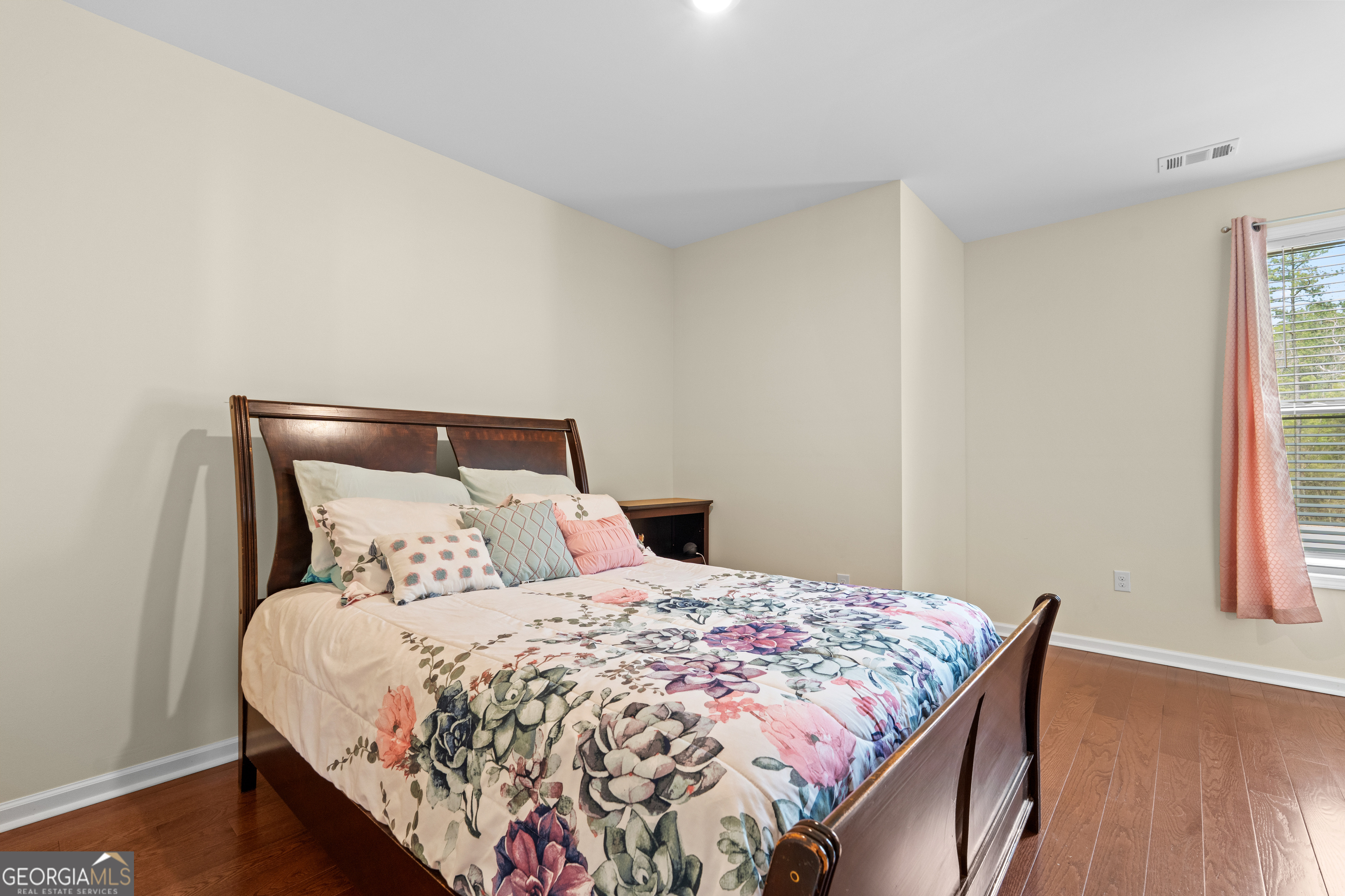 733 Cherry Road Franklin, GA 30217 - Photo 49 of 88 a large bed sitting in a bedroom next to a window