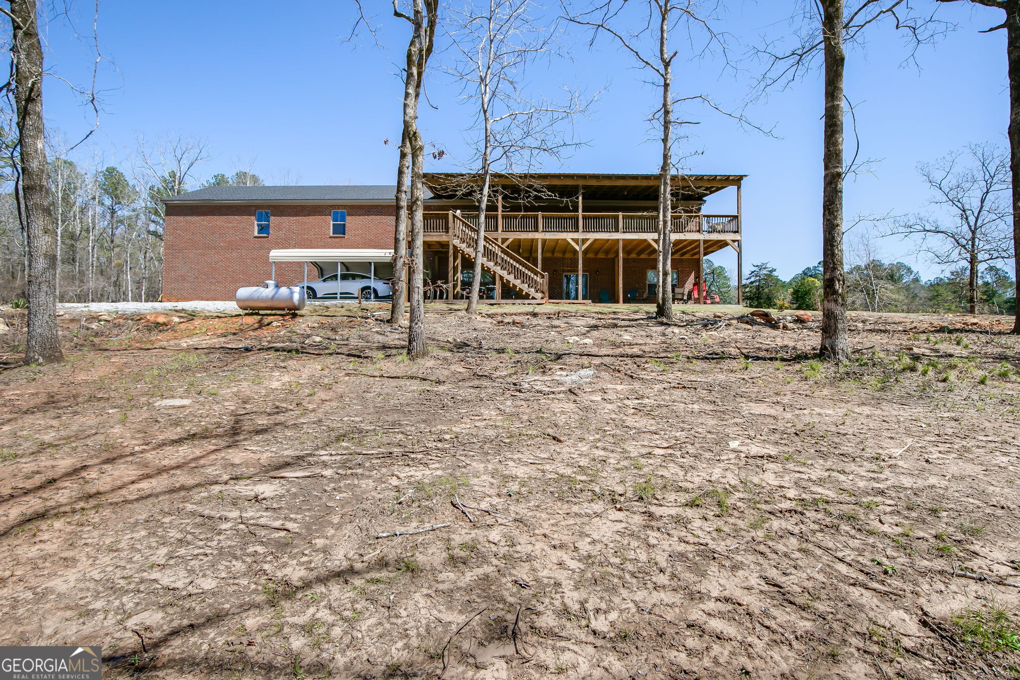 733 Cherry Road Franklin, GA 30217 - Photo 5 of 88 a view of a house with a yard and sitting area