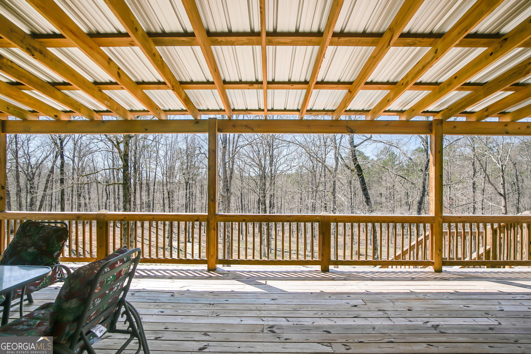 733 Cherry Road Franklin, GA 30217 - Photo 6 of 22 a view of a porch with furniture and wooden floor