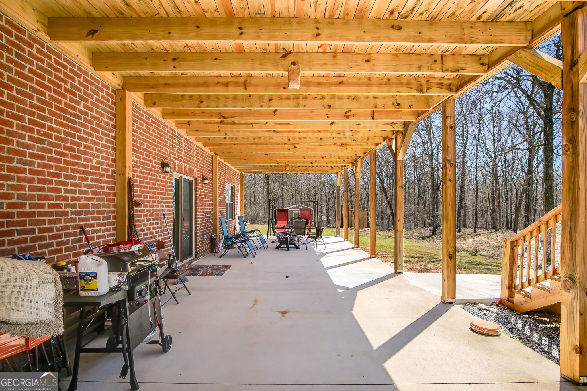 733 Cherry Road Franklin, GA 30217 - Photo 8 of 22 a view of a patio with a dining table and chairs