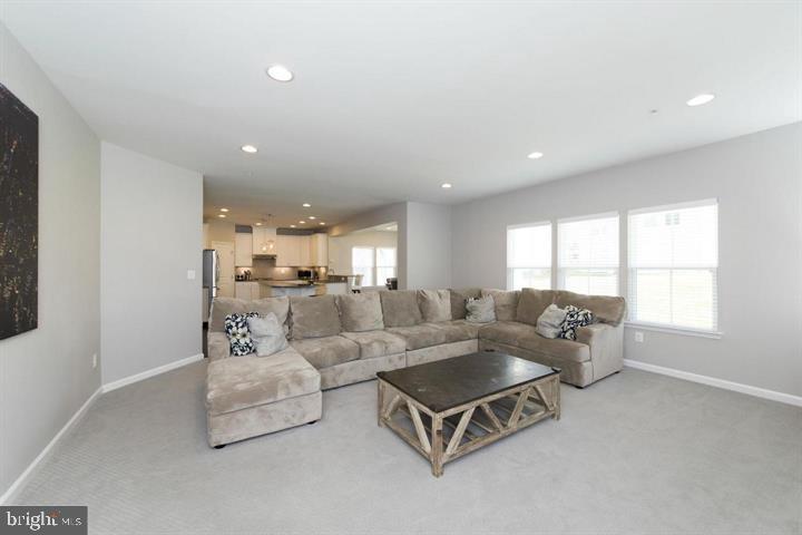 10431 Windlass Run Road Baltimore, MD 21220 - Photo 12 of 30 a living room with furniture and a large window