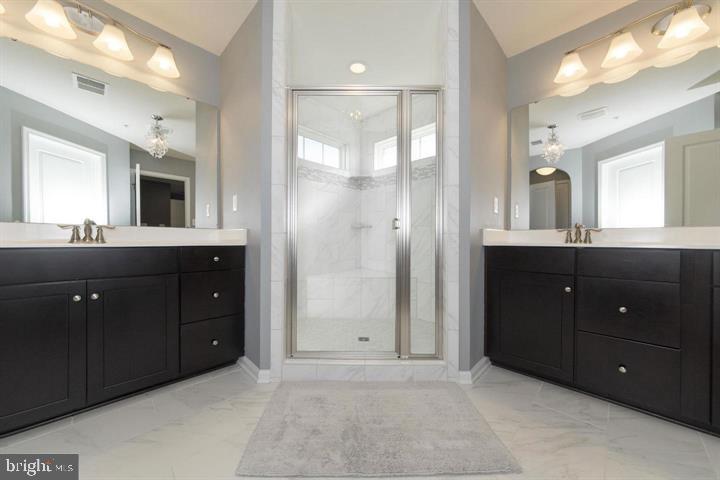 10431 Windlass Run Road Baltimore, MD 21220 - Photo 20 of 30 a bathroom with a sink vanity granite shower and a mirror
