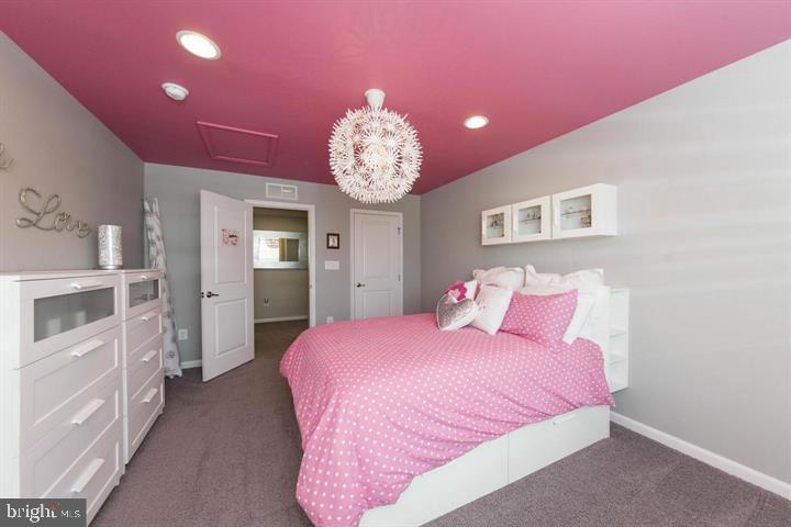 10431 Windlass Run Road Baltimore, MD 21220 - Photo 22 of 30 a bedroom with a bed and a chandelier