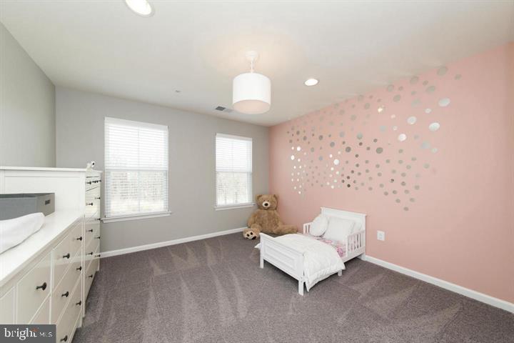 10431 Windlass Run Road Baltimore, MD 21220 - Photo 24 of 30 a living room with furniture and a chandelier