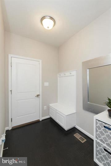 10431 Windlass Run Road Baltimore, MD 21220 - Photo 29 of 30 a room with a bed and cabinets