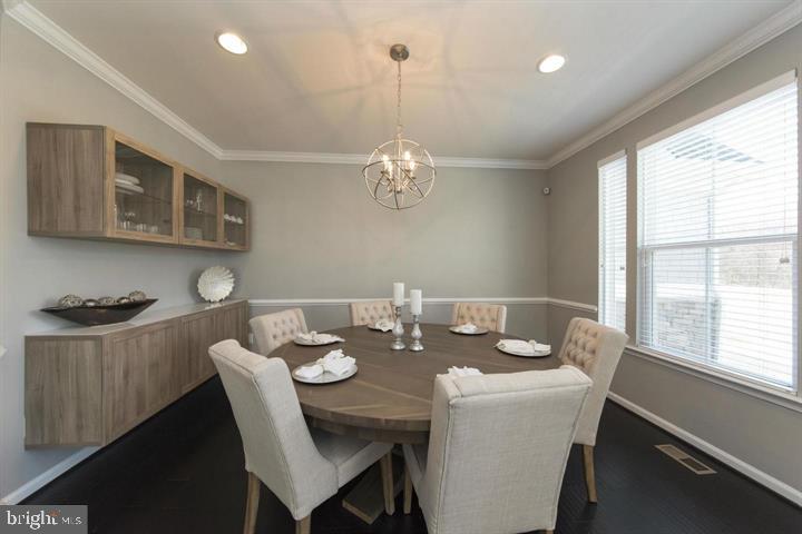 10431 Windlass Run Road Baltimore, MD 21220 - Photo 4 of 30 a kitchen with a dining table and chairs