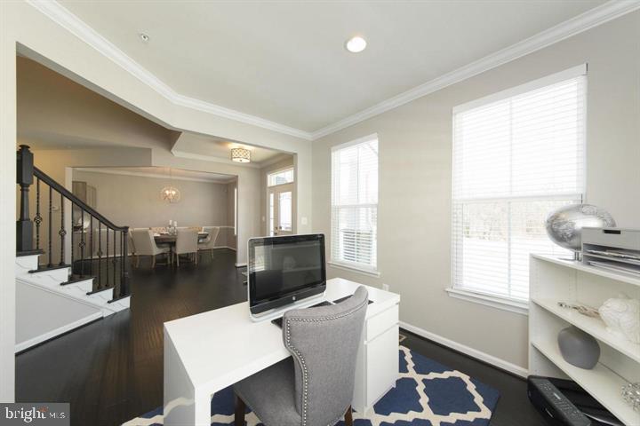 10431 Windlass Run Road Baltimore, MD 21220 - Photo 5 of 30 a living room with furniture a flat screen tv and a window