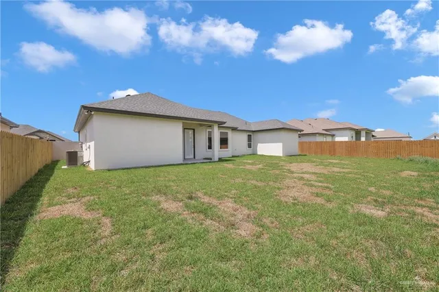 an aerial view of houses with swimming pool