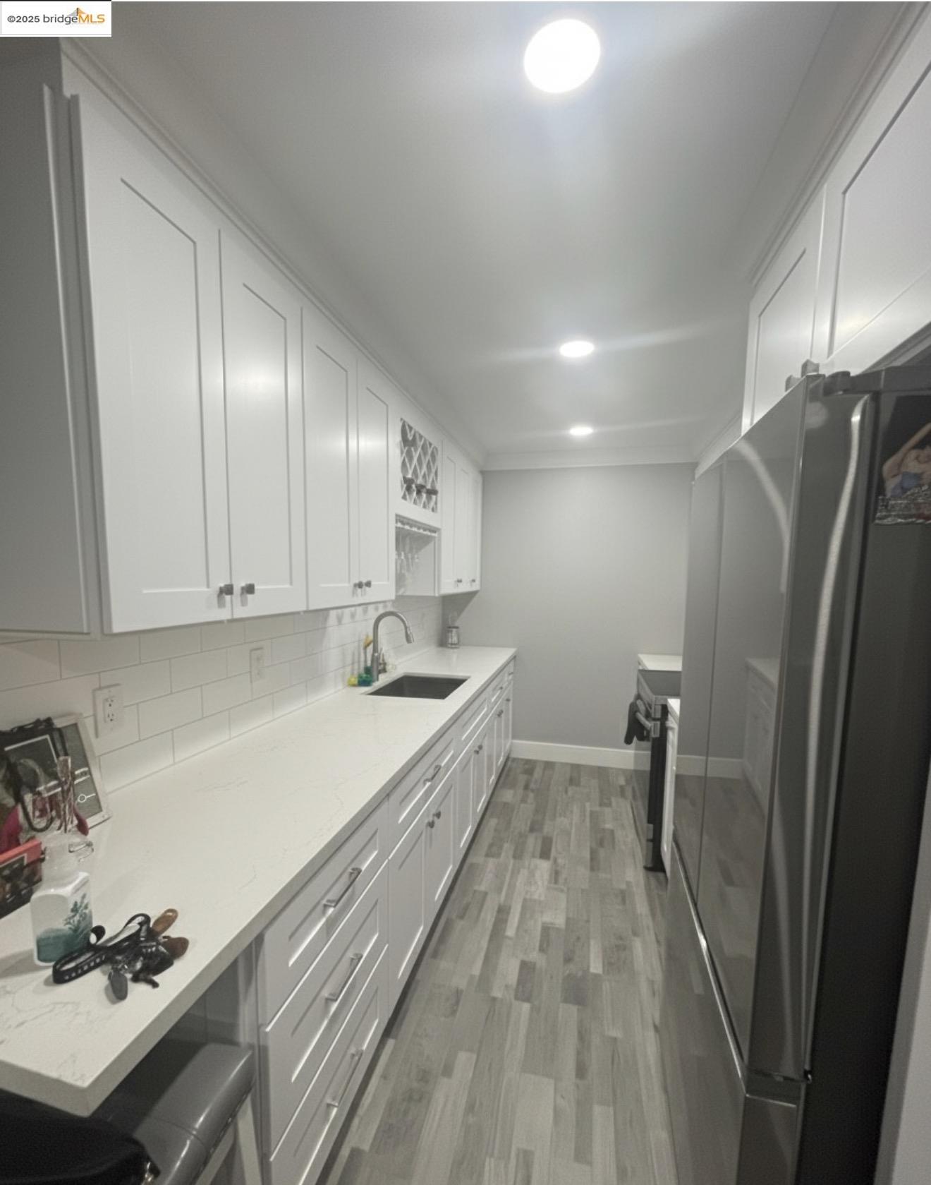 4081 Clayton Road, Unit 201 Concord, CA 94521 - Photo 1 of 7 a kitchen with granite countertop a refrigerator and a sink