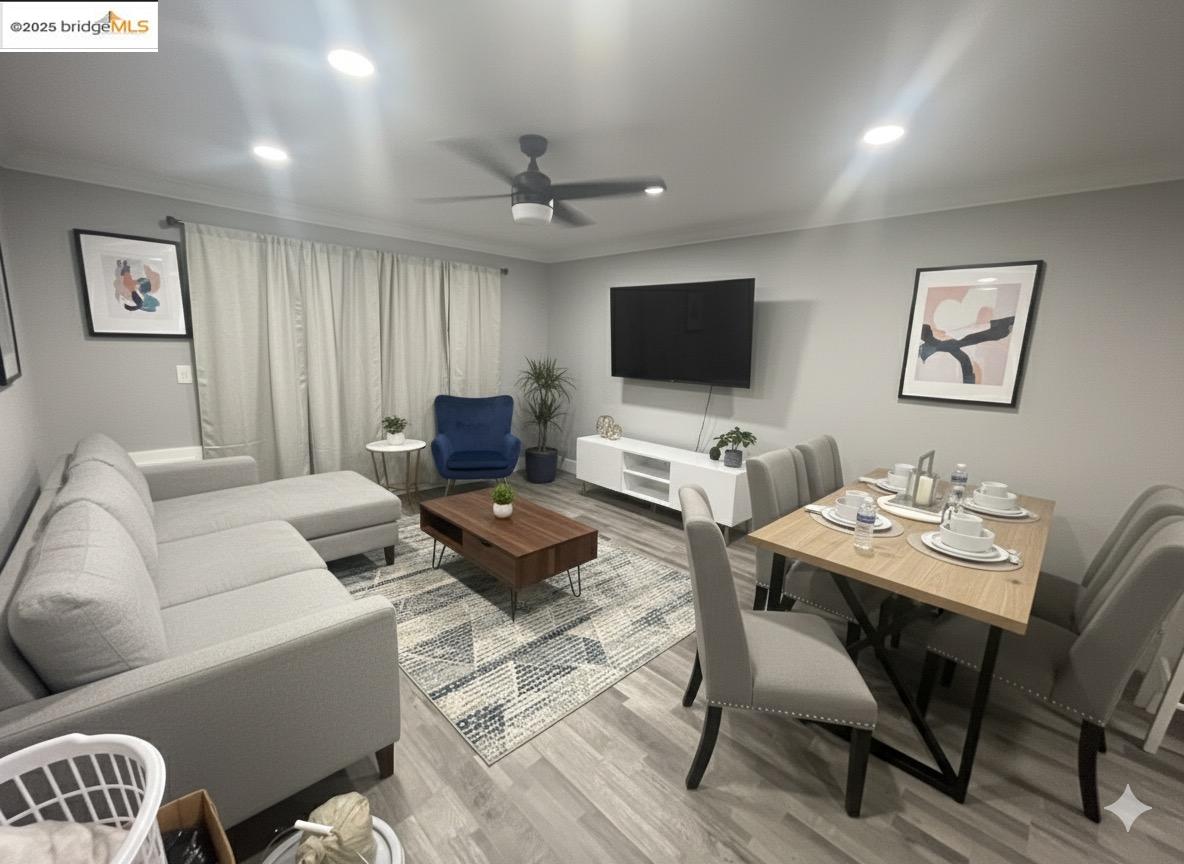 4081 Clayton Road, Unit 201 Concord, CA 94521 - Photo 3 of 7 a living room with furniture a flat screen tv and a window