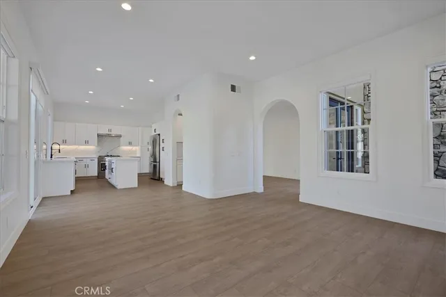 a kitchen with stainless steel appliances a refrigerator and a stove
