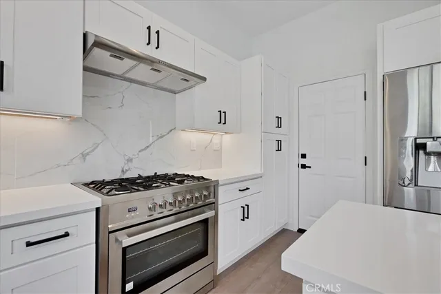 a bathroom with a double vanity sink and mirror