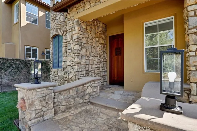 a front view of a house with outdoor space
