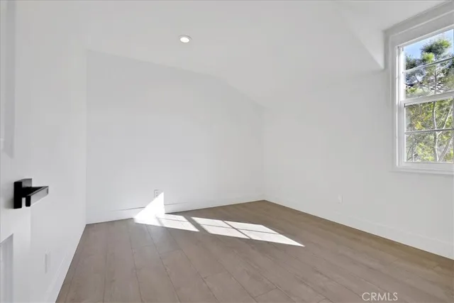 a bathroom with white cabinets