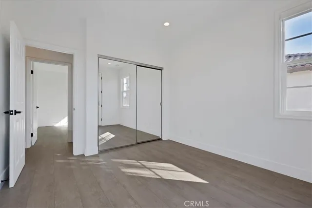 a bathroom with a double vanity sink toilet mirror and bathtub