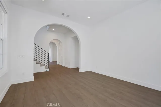 a view of a hallway with entryway door