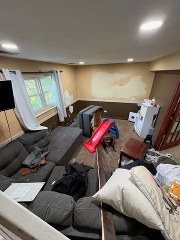 a bedroom with furniture and a bed