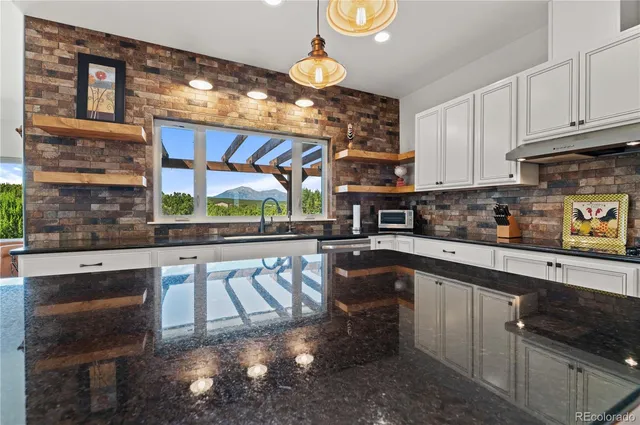 a kitchen with a sink cabinets and window