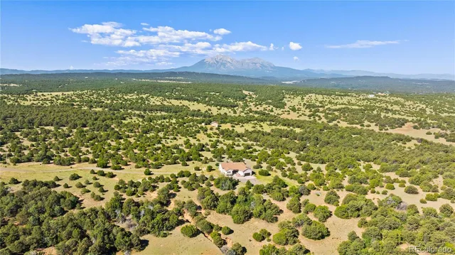 a view of a city with lots of yellow lighting