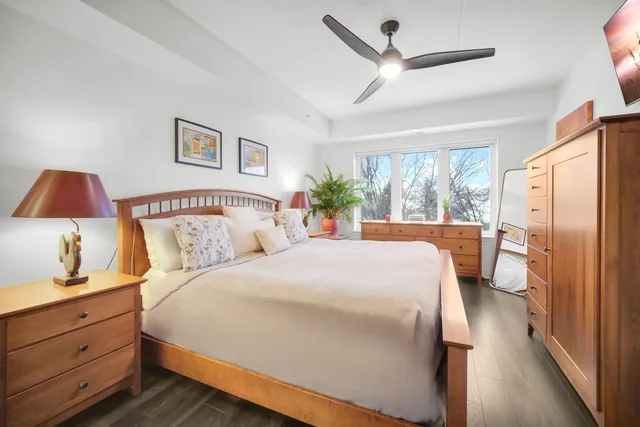 a bedroom with a large bed and a window