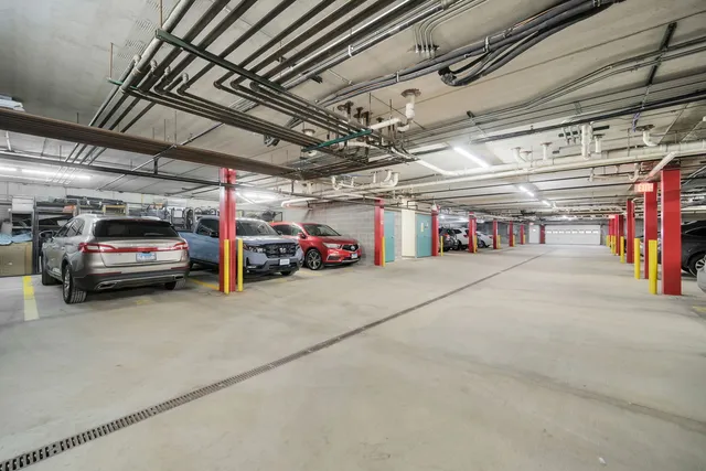 a view of parking garage with cars
