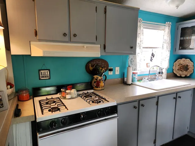 a dining room filled with furniture and a chandelier