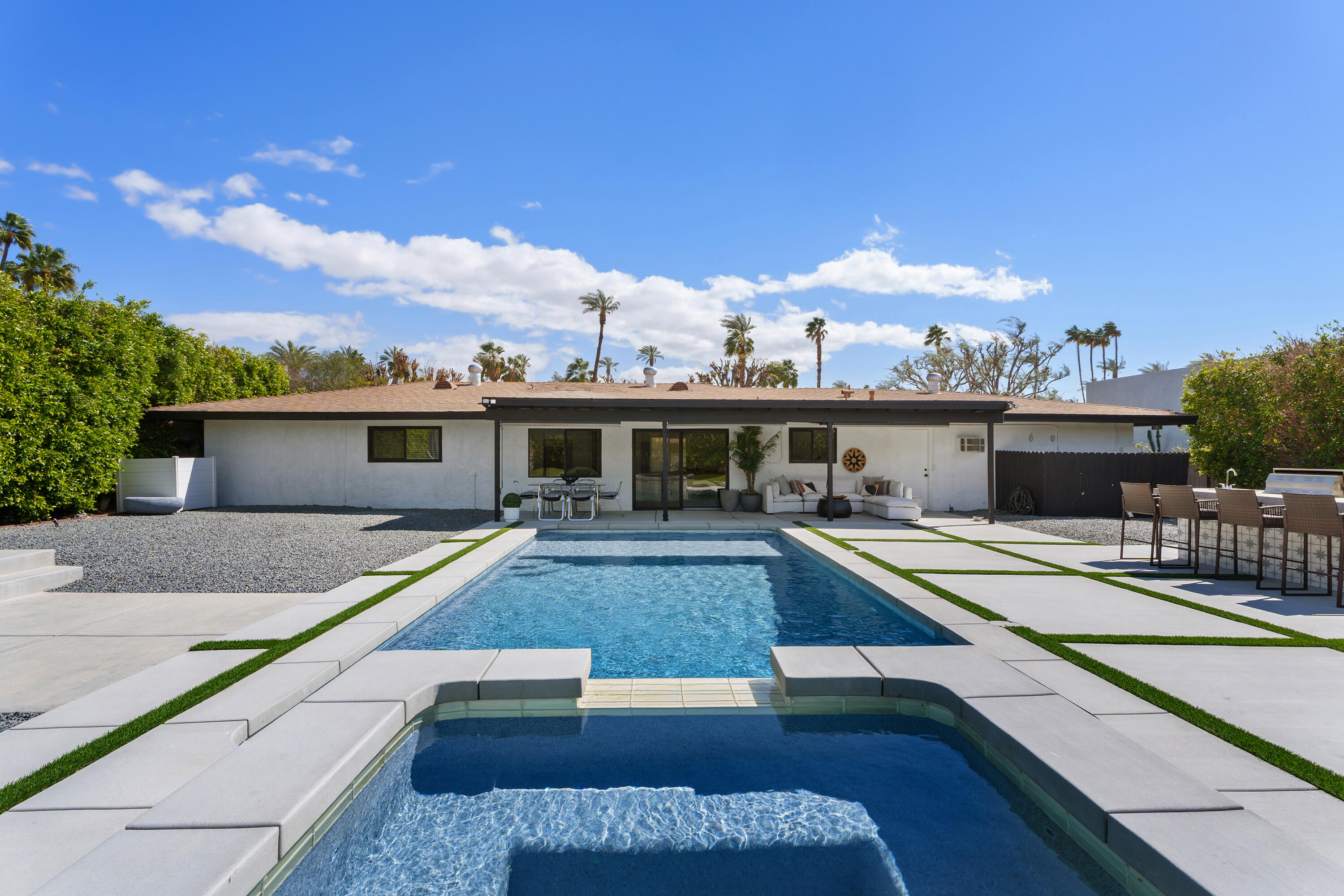 37081 Palmdale Road Rancho Mirage, CA 92270 - Photo 2 of 46 a view of a house with pool porch and furniture