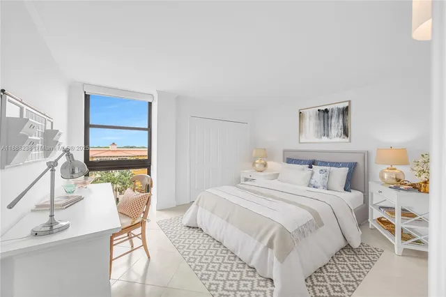 a bedroom with a bed and a desk