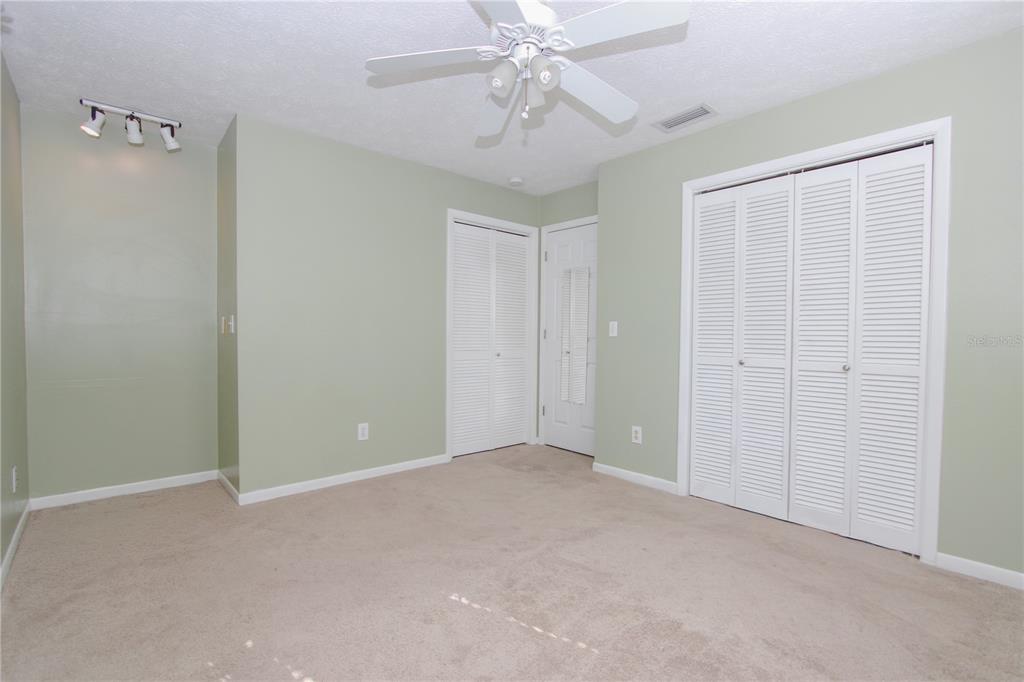 106 Phillips Drive Seffner, FL 33584 - Photo 32 of 48 an empty room with chandelier fan