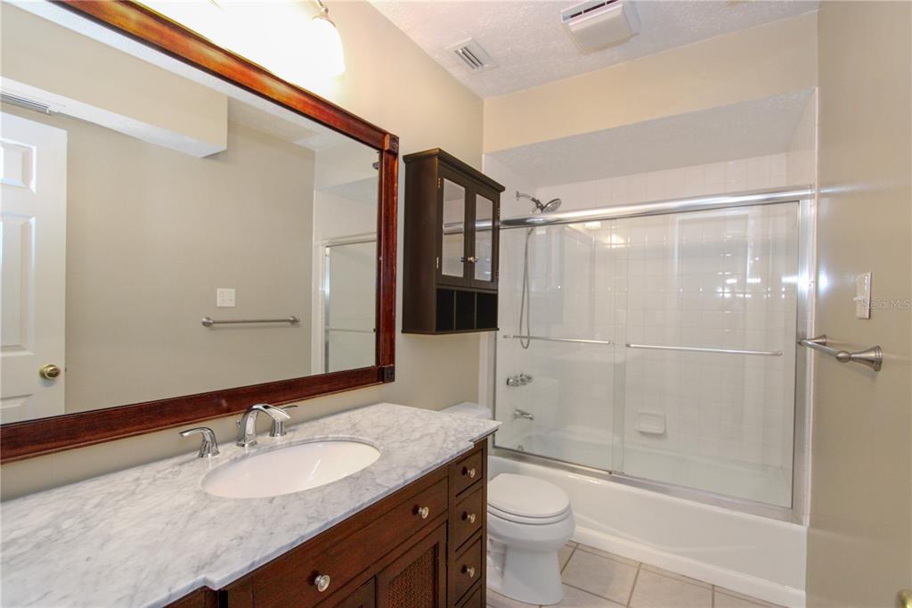 106 Phillips Drive Seffner, FL 33584 - Photo 34 of 48 a bathroom with a granite countertop sink toilet and shower