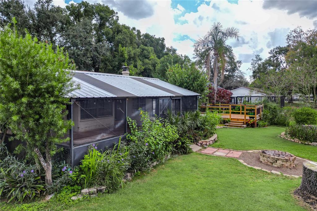 106 Phillips Drive Seffner, FL 33584 - Photo 47 of 48 a aerial view of a house next to a big yard and large trees