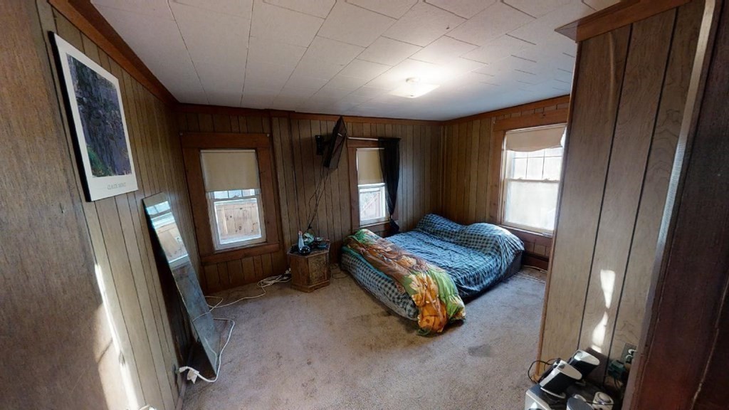 11 River Road Templeton, MA 01436 - Photo 12 of 32 a room with a bed and a mirror