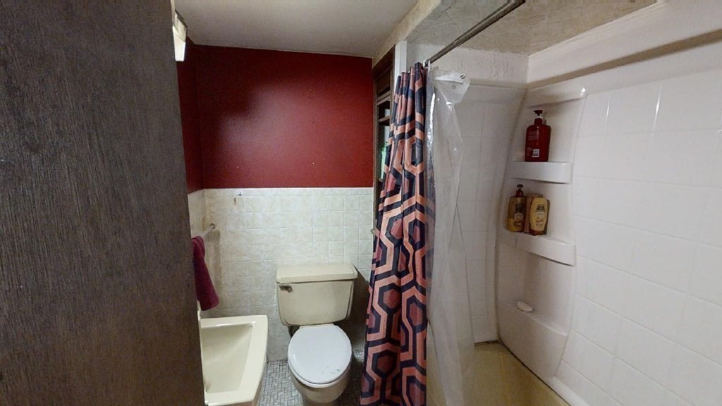11 River Road Templeton, MA 01436 - Photo 13 of 32 a white toilet sitting next to a shower curtain
