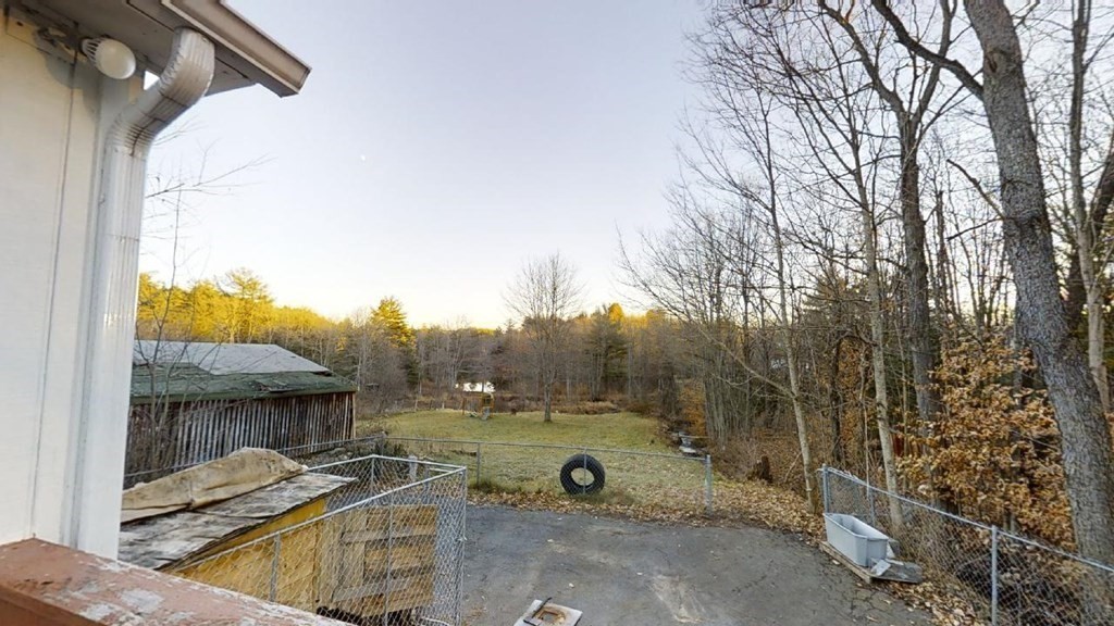 11 River Road Templeton, MA 01436 - Photo 4 of 32 a view of a backyard with wooden fence and a porch