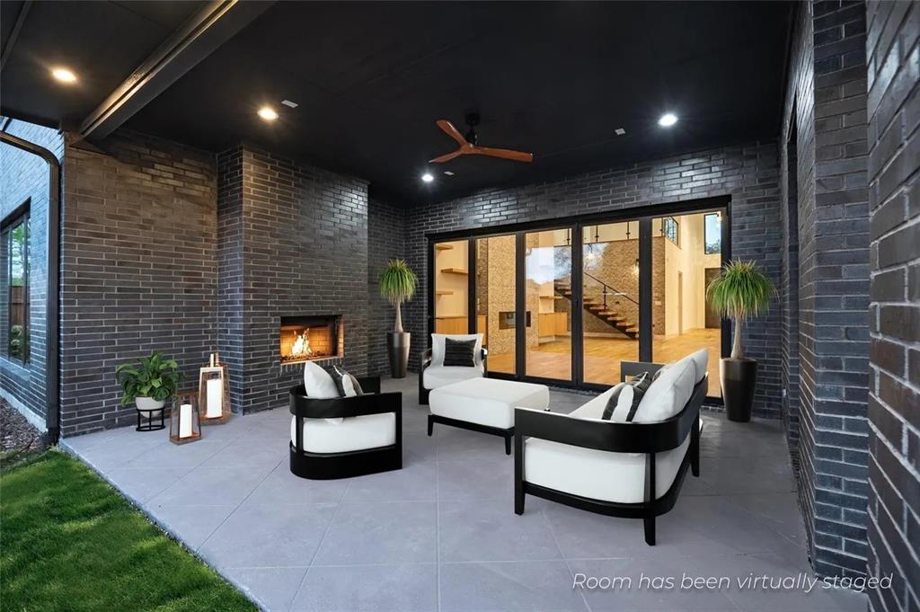309 Kaye Street Coppell, TX 75019 - Photo 10 of 36 Covered outdoor patio featuring a gray brick fireplace, recessed lighting, and a ceiling fan