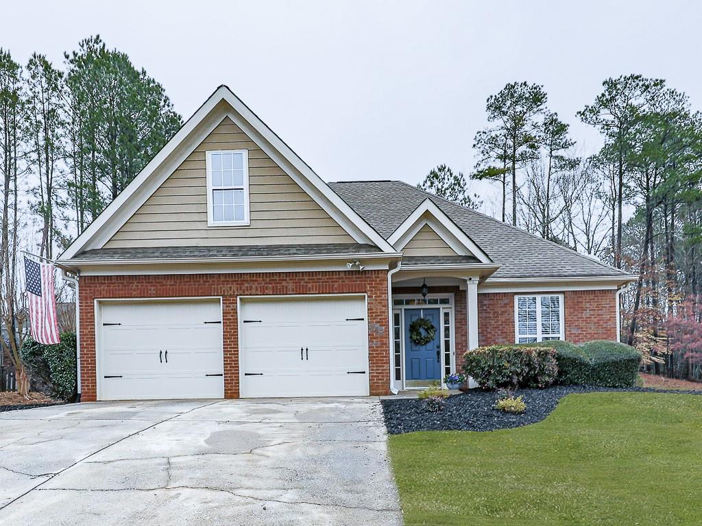 102 Springshade Court Canton, GA 30114 - Photo 1 of 78 a front view of a house with a yard and garage