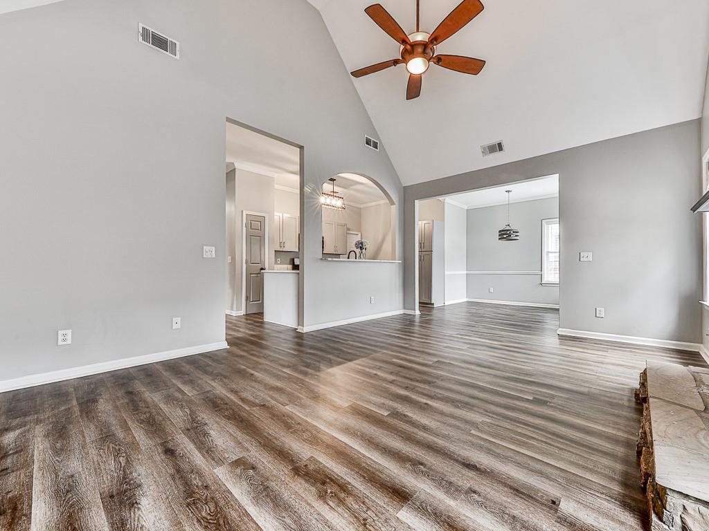 102 Springshade Court Canton, GA 30114 - Photo 11 of 78 a view of an empty room with wooden floor and a ceiling fan