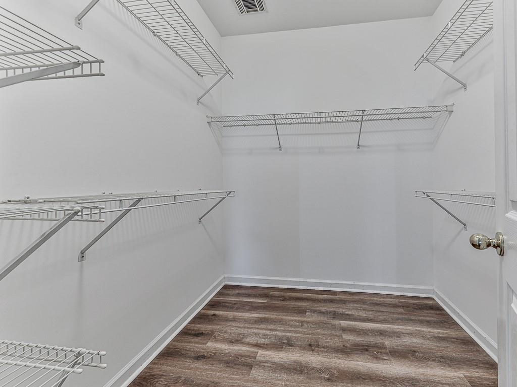 102 Springshade Court Canton, GA 30114 - Photo 30 of 78 a view of a room with racks on the wall